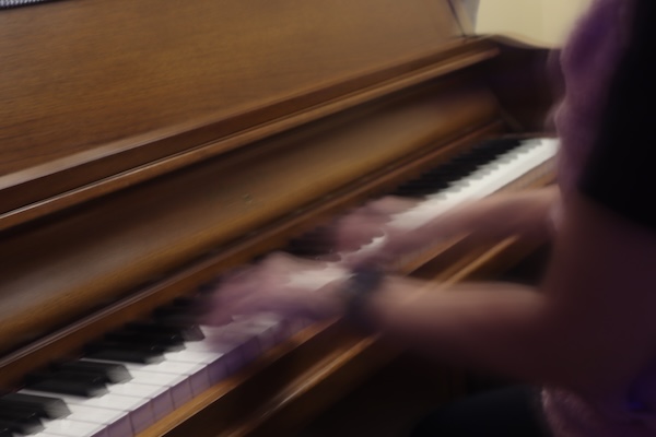 Motion blur image of piano playing